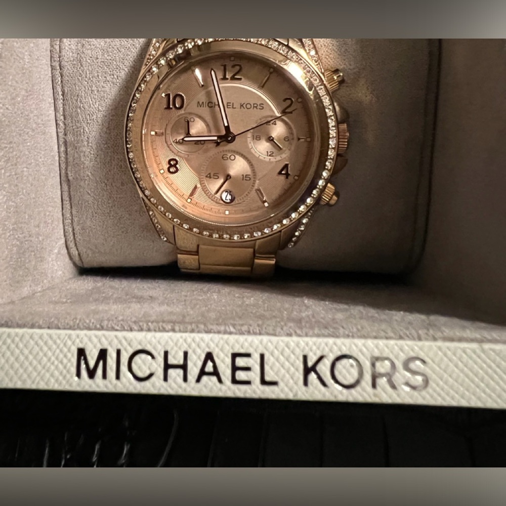 Michael Kors women’s rose gold-tone stainless steel watch.